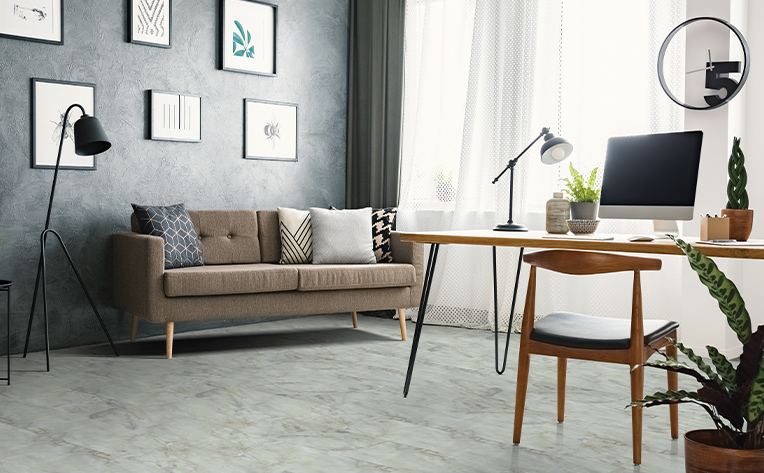 home office with grey floors and brown desk chair